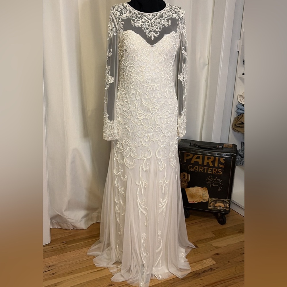 Ivory sequined wedding dress size 8 sheer beaded bodice and long sleeves long